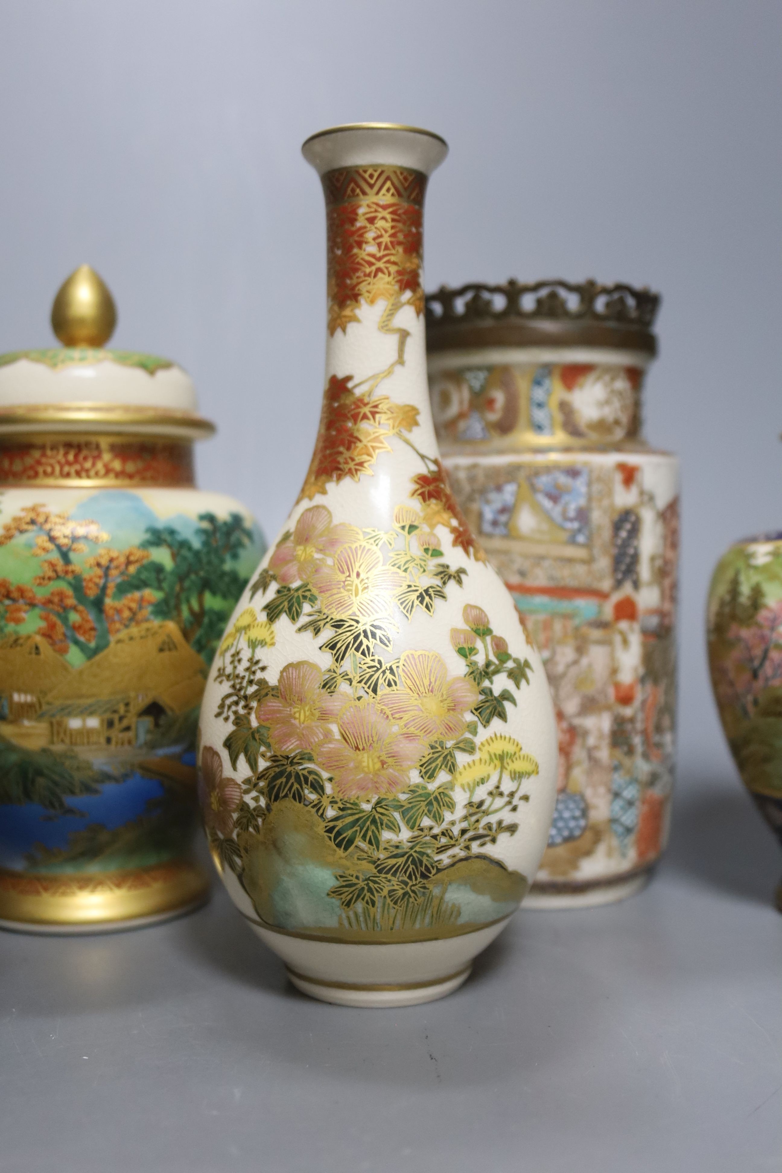A collection of Japanese Satsuma, vases, bowls and lidded jars, 9 items in total, tallest item,18 cms high.